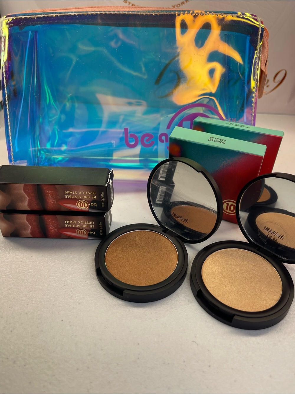 Be a 10 5 piece bundle!! Highlighter/bronzer duo & 2 ph lippies! And the fab bag